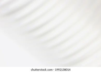 White Fuzzy Background With Blurry Image Of Corrugated Tube. High Quality Photo