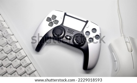 white gaming controller and white gaming mouse keyboard