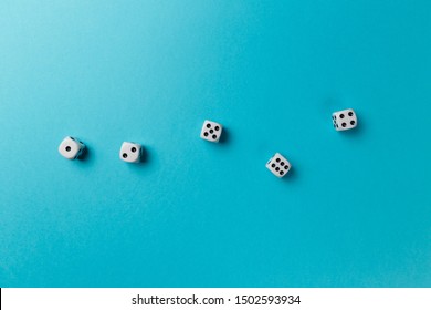 White gaming dice on blue background. Top view. Flat lay. Copy space. Game of chance concept. Close-up. Pastel colors - Shutterstock ID 1502593934