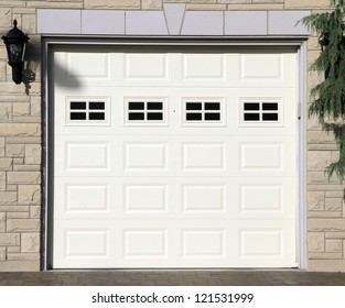 White Garage Door Of A Detached House
