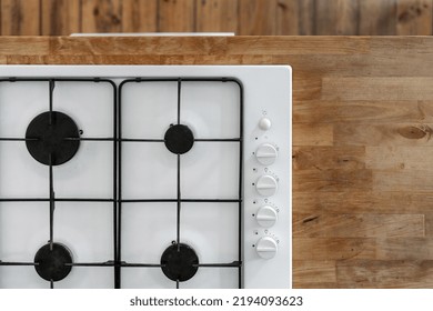 White Gas Stove Built In Wooden Countertop At Contemporary Kitchen, Knob Switch At Control Panel For Regulation Temperature For Cooking