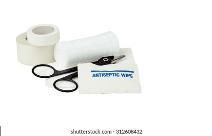 White Gauze Bandage Roll And Pad With Antiseptic Wipe, Medical Scissors And Medical Tape Isolated On White