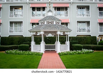 White Gazebo With Brick Pathway