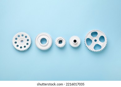 White gears wheels flat lay symbolizing idea, cooperation or teamwork, work and connection concept. Top view minimalist concept
 - Shutterstock ID 2216017035