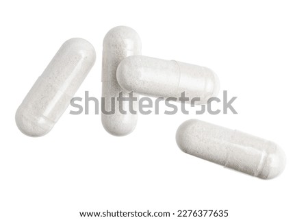 White gel medical capsules, group of vitamin supplement pills or drugs for treatment, isolated on white background, medicine and healthcare concept, top view.