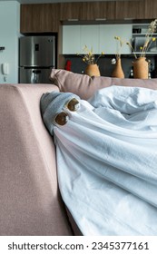 A white ghost with black eyes, made from a bed sheet. - Shutterstock ID 2345377161