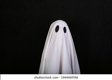 White Ghost on black background. Halloween holiday party - Powered by Shutterstock