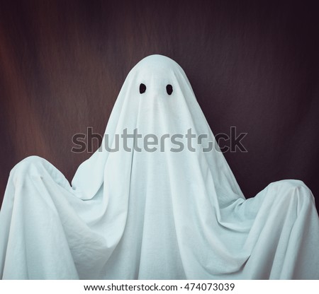 White Ghost on a gray background. Halloween holiday