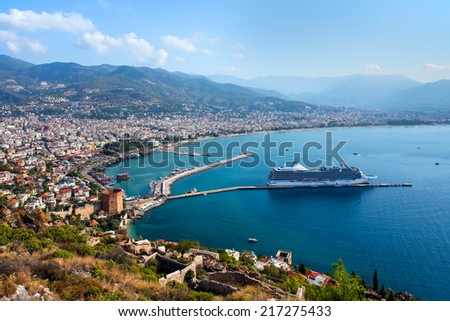 White giant luxury cruise ship on stay at Alanya harbor - Alanya, Antalya