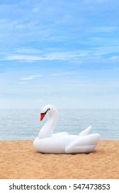 White Giant Swan Inflatable On The Beach