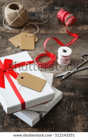 Similar – Foto Bild Weiße Geschenkbox mit Aufkleber auf Holztisch.