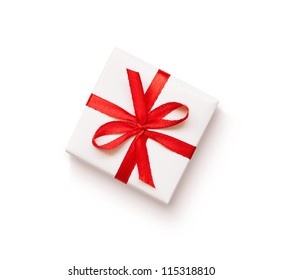 White gift with red ribbon on white background - Powered by Shutterstock