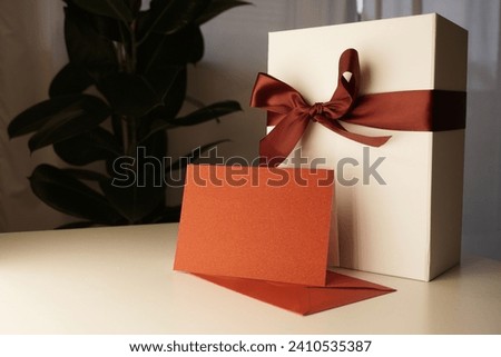 White giftbox with flowers on the background