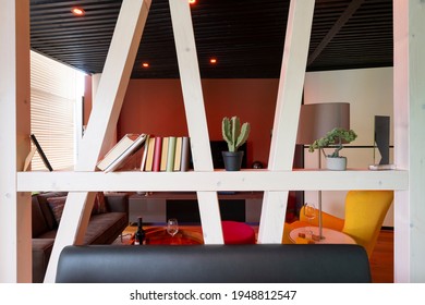 White Glazed Wooden Beams, Half-timbered Optics As Modern Room Dividers With Books And Decorations