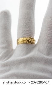 A White Glove With Hand Crafted Mens Rings In Silver And Gold. High Quality Mens Jewellery Rings.