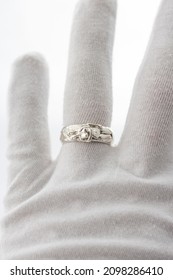 A White Glove With Hand Crafted Mens Rings In Silver And Gold. High Quality Mens Jewellery Rings.