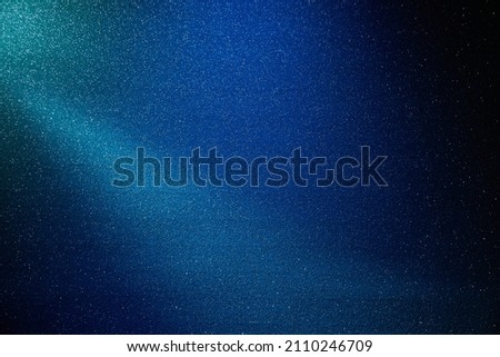 White glow on blue gradient grainy background