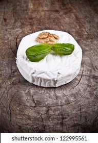 White Goat Cheese With Noble Rot On Wooden Table