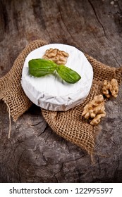 White Goat Cheese With Noble Rot On Wooden Table