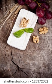 White Goat Cheese With Noble Rot On Wooden Table