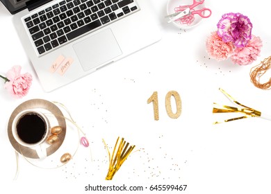 White, Gold And Pink Womens Office Desk Table With A Lot Of Things On It. Top View With Copy Space. 10 Ten