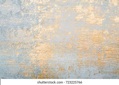 White and golden messy wall stucco texture background. Decorative wall paint. - Shutterstock ID 723225766