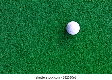 White golf ball on artificial grass