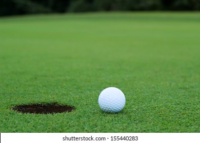 White Golf Ball On Putting Green
