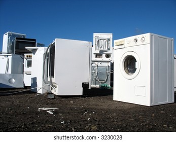 White goods in a dump with no visual brand names.