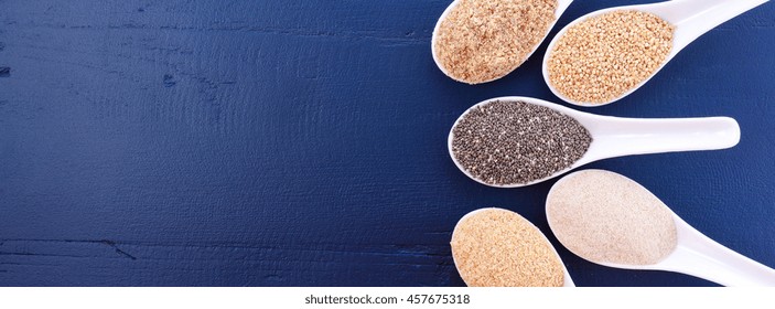 White Grain Quinoa, Psyllium Husk Powder, Black Chia, Wheat Germ, And Ground LSA Mix, In Measuring Spoons, Sized To Fit A Popular Social Media Cover Image Placeholder.. 