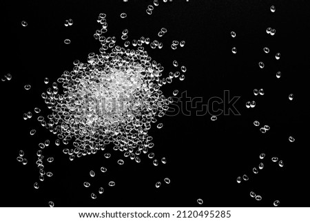 white granules of polypropylene, polyamide in a test tube. Background. Plastic and polymer industry. Microplastic products.