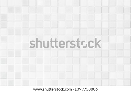 White or gray ceramic wall and floor tiles abstract background. Design geometric mosaic texture for the decoration of the bedroom. Simple Seamless Poly art or Hypnotic at kaleidoscope. 商業照片 © 