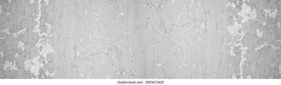 White gray grey stone concrete cement scratched peeled off weathered grunge wall or floor texture, with cracks background panorama banner long