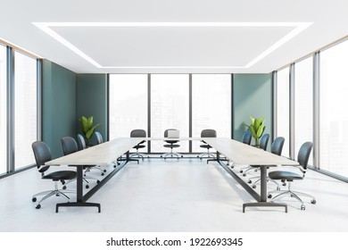 White And Green Office Conference Room With White U-shape Table, Grey Leather Chairs And Windows. Office Minimalist Furniture And Plants, White Floor. 3D Rendering, No People