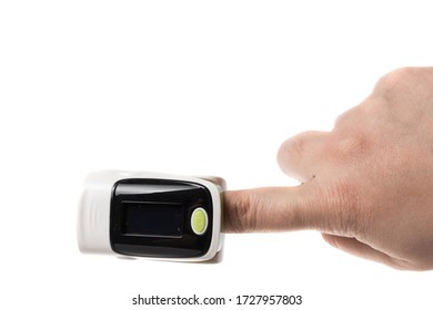 White And Green Puls Oxymeter On A Finger, Isolated On White Background