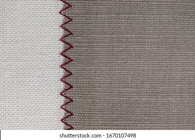 White And Grey Fabric Stitched With A Zigzag Purple Thread. Stitched Pieces Of Fabric Close-up. Zigzag Stitch.