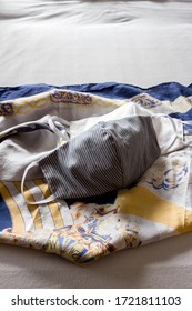 white and white and grey facemask on patterned scarf
