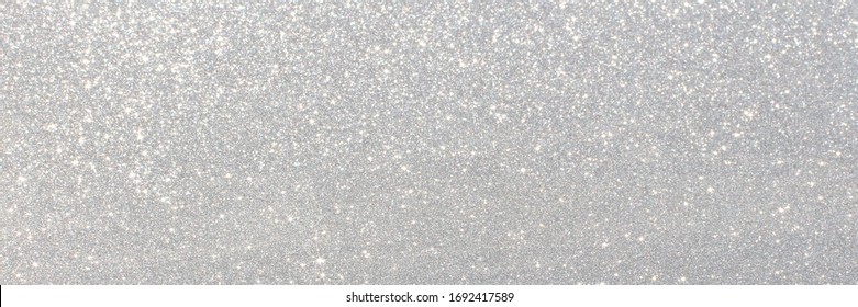 White And Grey Glitter Bokeh Circle Glow Blurred And Blur Abstract. Glittering Shimmer Bright Luxury. White And Silver Glisten Twinkle For Texture Wallpaper And Background Backdrop.
