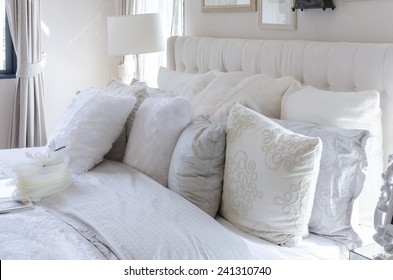 White And Grey Pillows On Bed In Luxury Bedroom