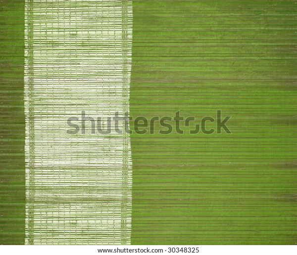 white grunge bamboo\
bar on green wood slats