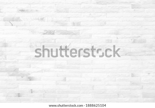 White grunge brick wall texture\
background for stone tile block painted in grey light color\
wallpaper modern interior and exterior and room backdrop\
design