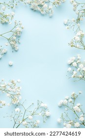 White gypsophila flowers or baby's breath flowers  on blue  background.  Copy space. - Shutterstock ID 2277424619