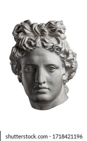 White Gypsum Copy Of Ancient Statue Of Apollo God Of Sun Head For Artists On A White Background. Plaster Sculpture Of Man Face. Renaissance Epoch. Portrait.