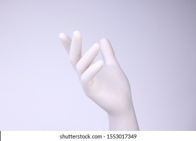 
White Hand. Hand With White Glove On Light Background.
