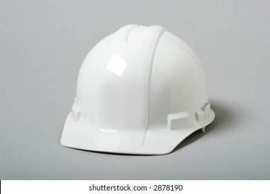 White Hardhat On Grey Background