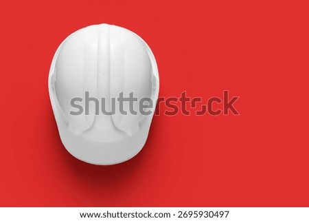 White hardhat on red background