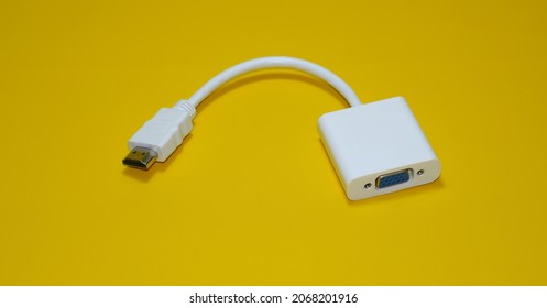 White HDMI to VGA converter cable on yellow background isolated - Shutterstock ID 2068201916