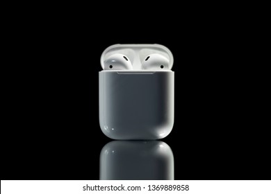 white headphones airpods on black background