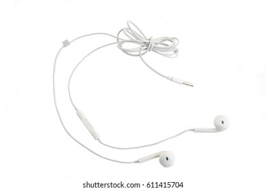 White headphones with headset lie on white isolated background