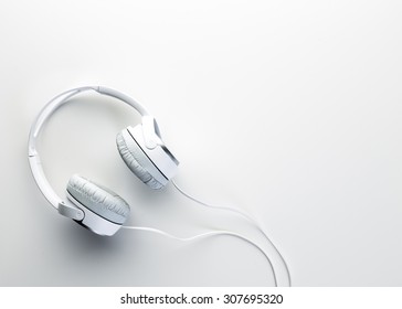 White headphones on white background